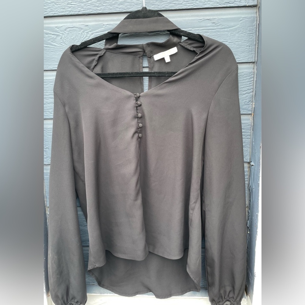 Black WAYF blouse. Cold shoulder mock neck.